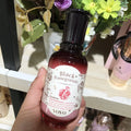 Six-piece pomegranate skincare set showing water, milk, cream, essence, eye cream and cleanser bottles