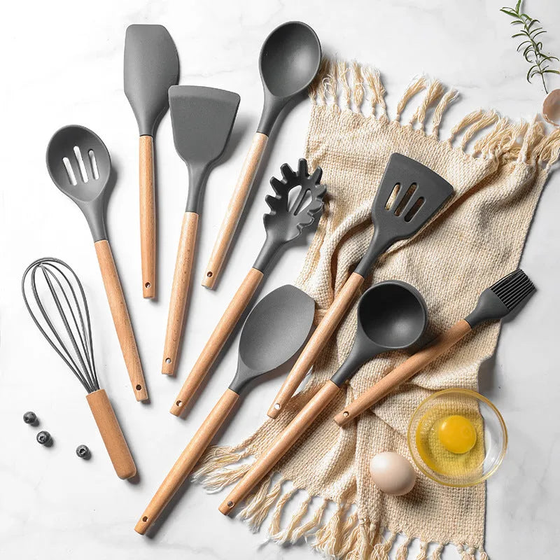 12-piece silicone kitchenware set with wooden handles and non-stick heads in a colour box package