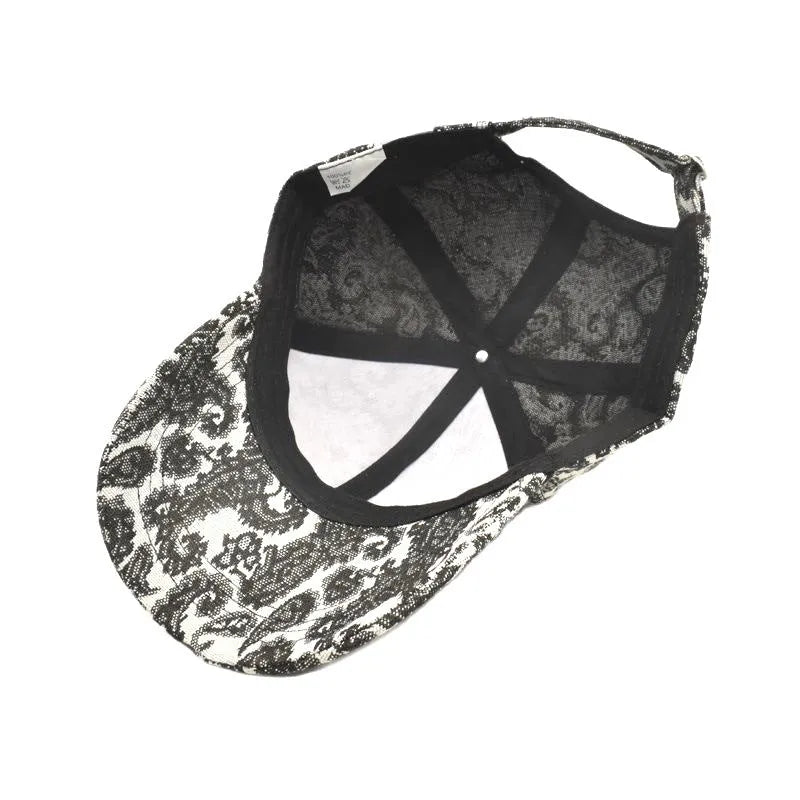 Blue polyester baseball cap with a white paisley pattern printed on the dome crown.