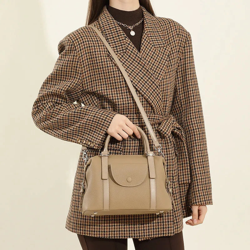 Genuine leather women's handbag in black, brown, or elephant grey with contrast stitching.