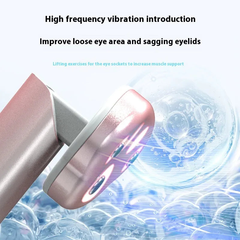 Pink gradient cat's paw shaped eye massager with micro-current vibration and colour light therapy.