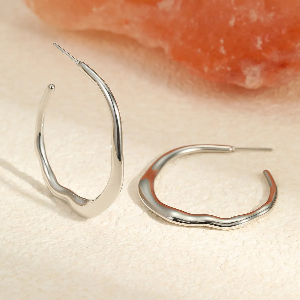 C-ring earrings in stainless steel with 18K gold plating, geometric shape, gold and steel colour options, sold as a pair
