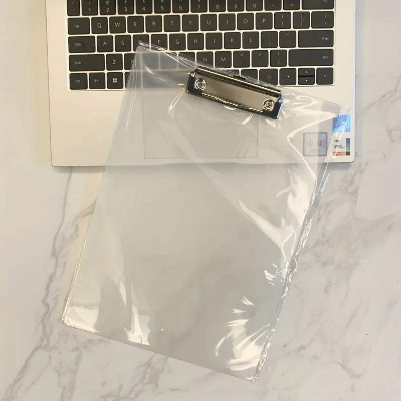 A4 transparent plate holder writing board with metal clip, shown in blue on a desk.