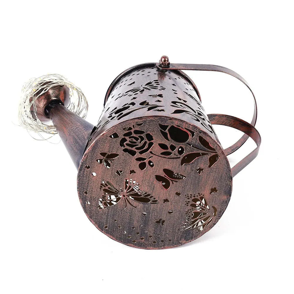 Solar garden lamp with tapered butterfly iron lantern design in warm white LED illumination