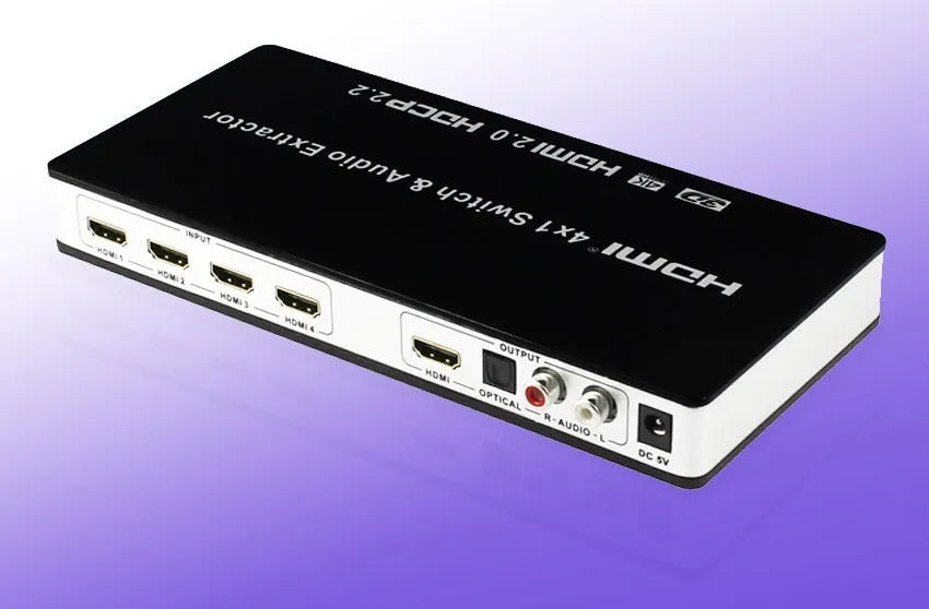 Black 4-input 1-output HDMI audio video switch with remote control on a table.