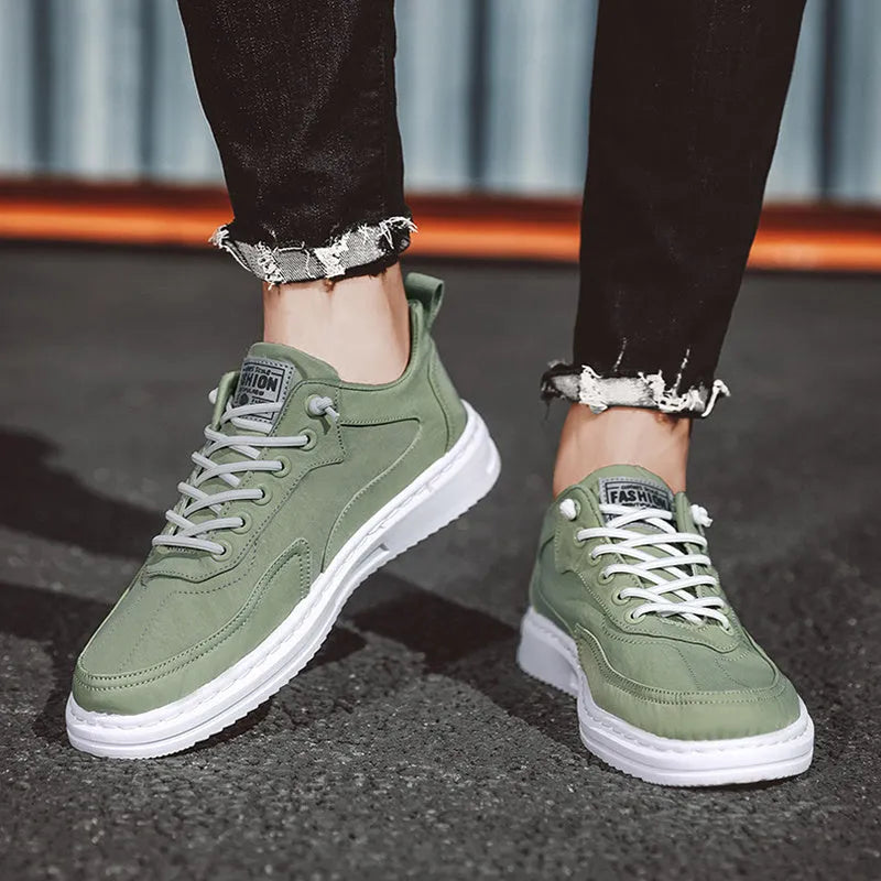 Men's canvas sneakers with letter print, elastic lace-up, breathable mesh lining, platform rubber sole, available in green black grey.