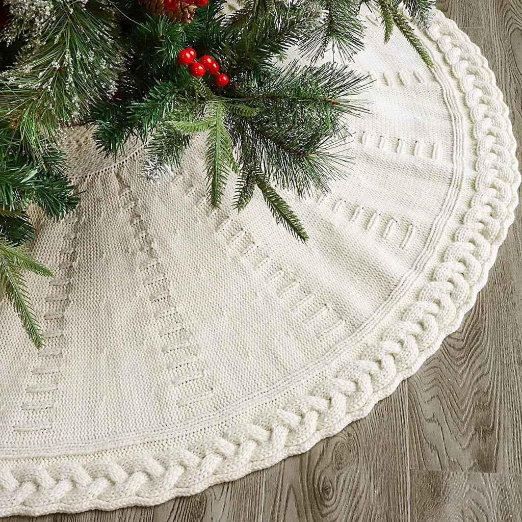 Round wool knitted Christmas tree skirt, 122cm diameter, in red or milky white, shown around a tree base