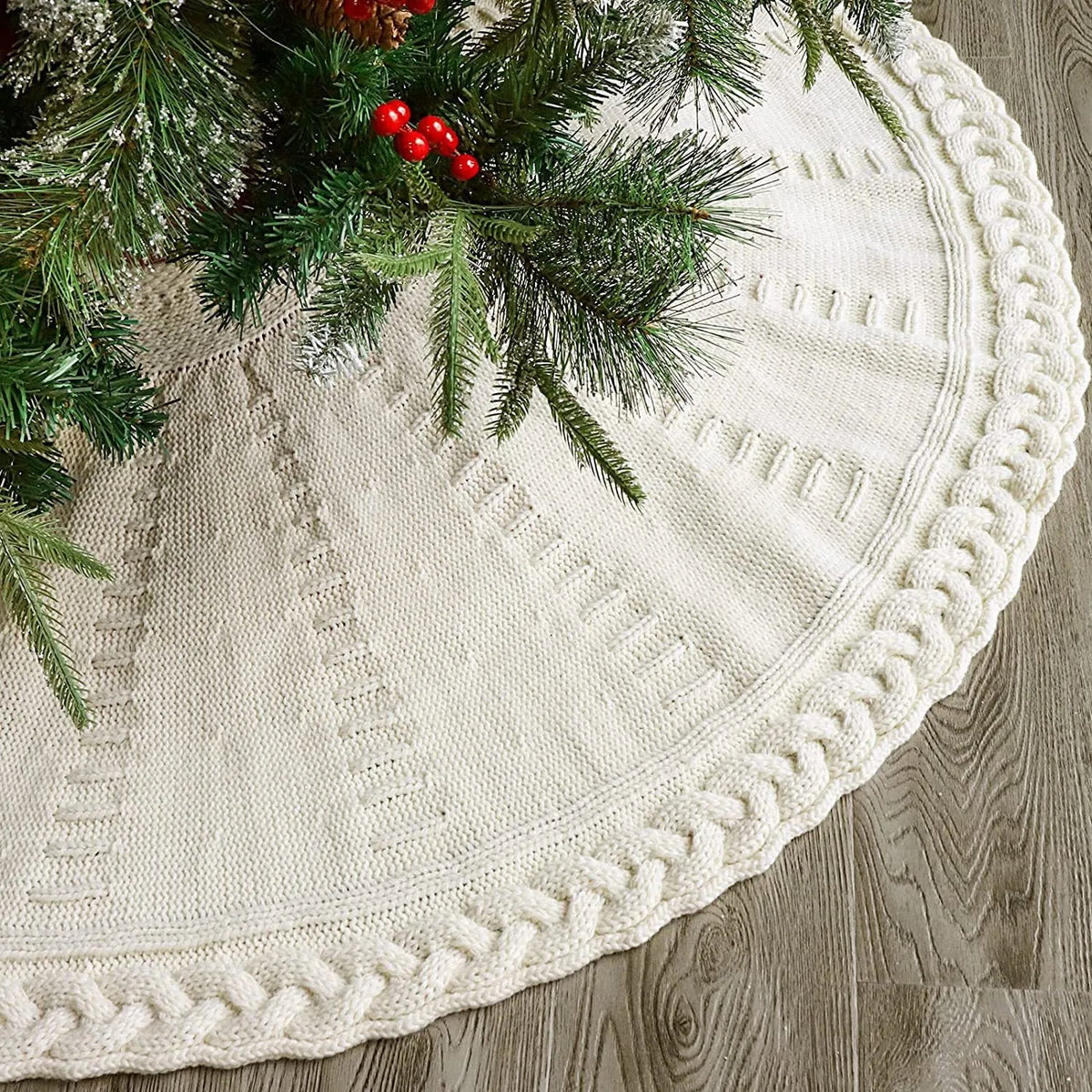 Round wool knitted Christmas tree skirt, 122cm diameter, in red or milky white, shown around a tree base