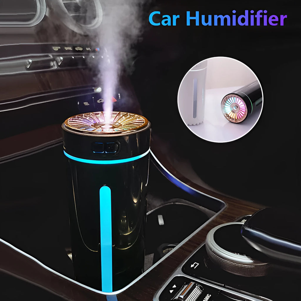 Black and white portable wireless humidifier with LED lights on a car cup holder and desktop