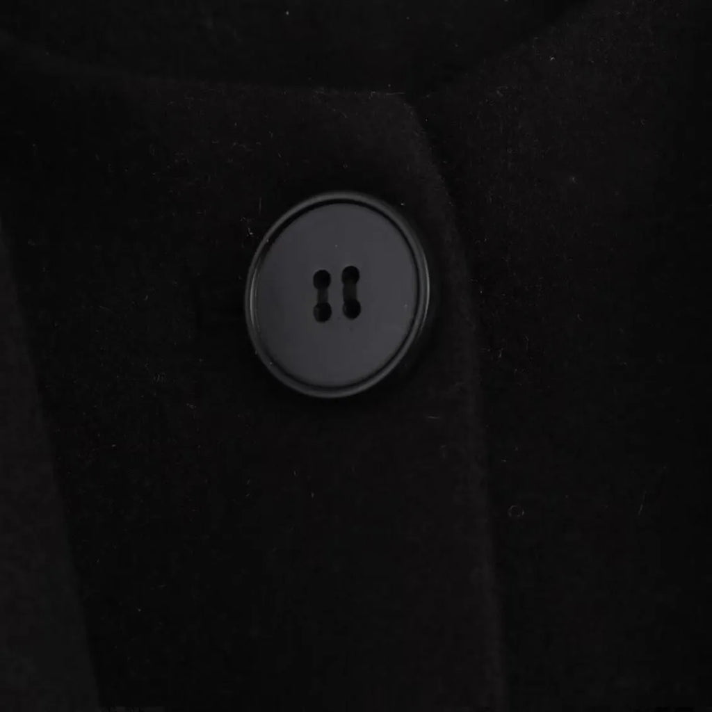 Women's long grey coat with an artificial fur collar, shown with pockets and a street fashion style.