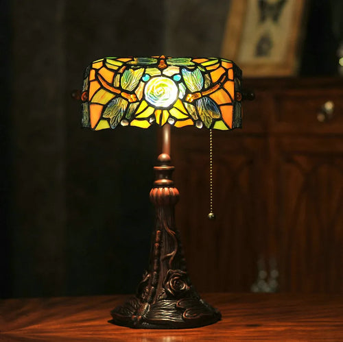10-inch Tiffany table lamp with stained glass design and resin base on wooden desk