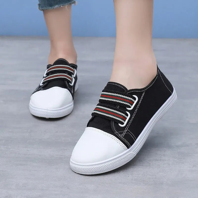 Breathable non-slip slip-on canvas sneakers with flat heel and round toe in black, white, or yellow