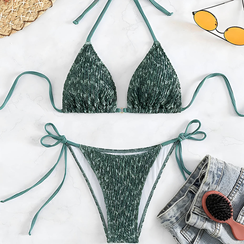 Women's green halter backless swimsuit with three-point design showing front and back styling