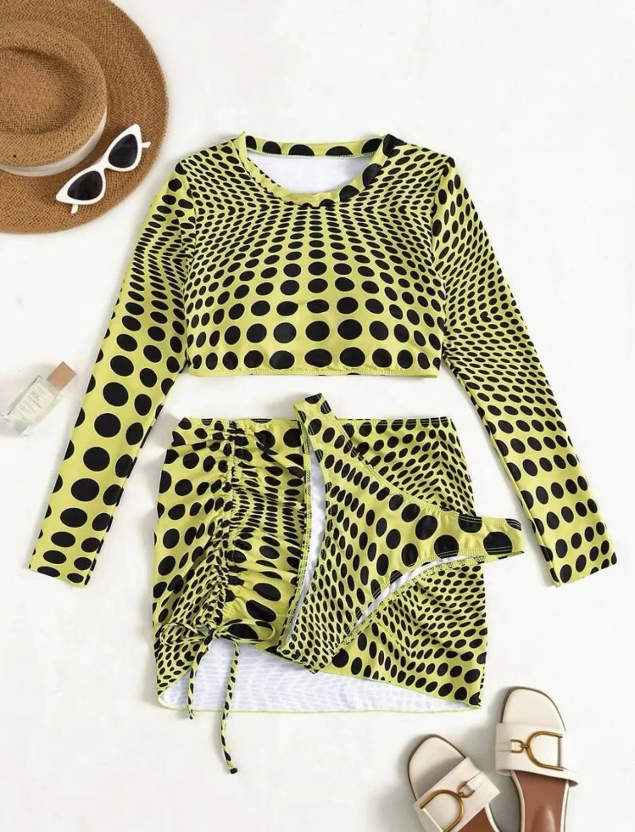 Women's green polka dot swimsuit three-piece set showing top, skirt, and bra