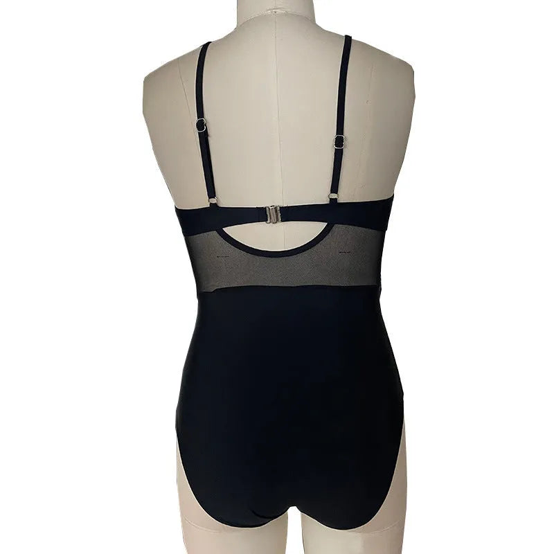 Women's mesh spliced backless one-piece swimsuit in black with polyester lining, size S to 2XL