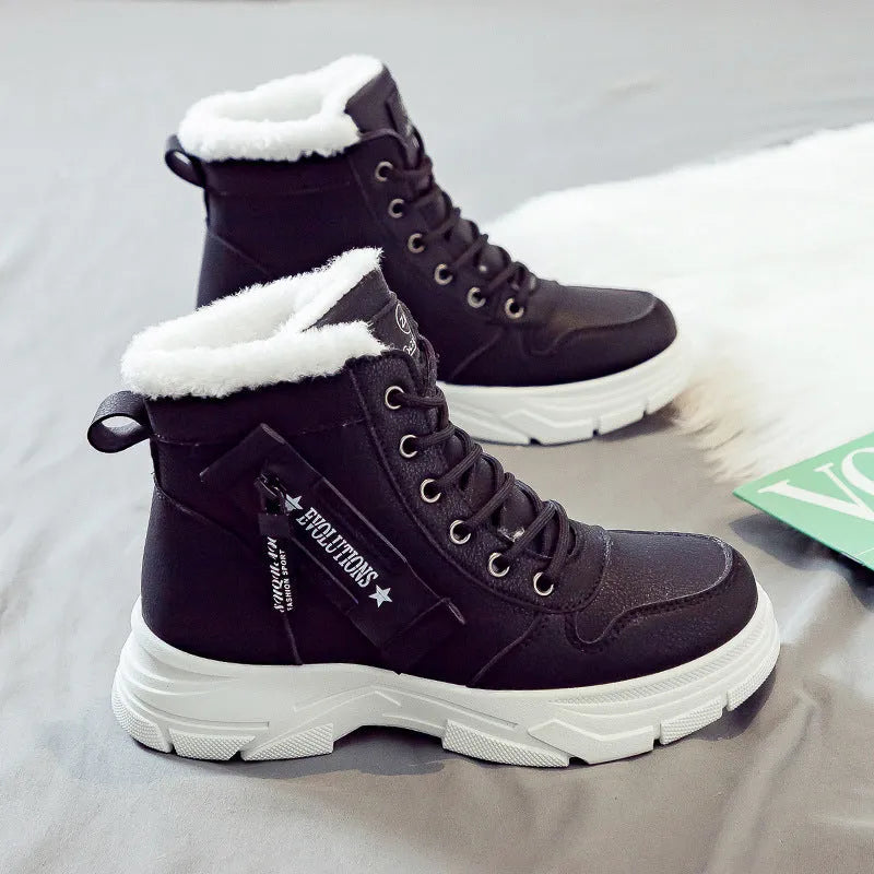 Plus size women's snow boot in black with velvet lining, showing mid-calf height and front lace-up.