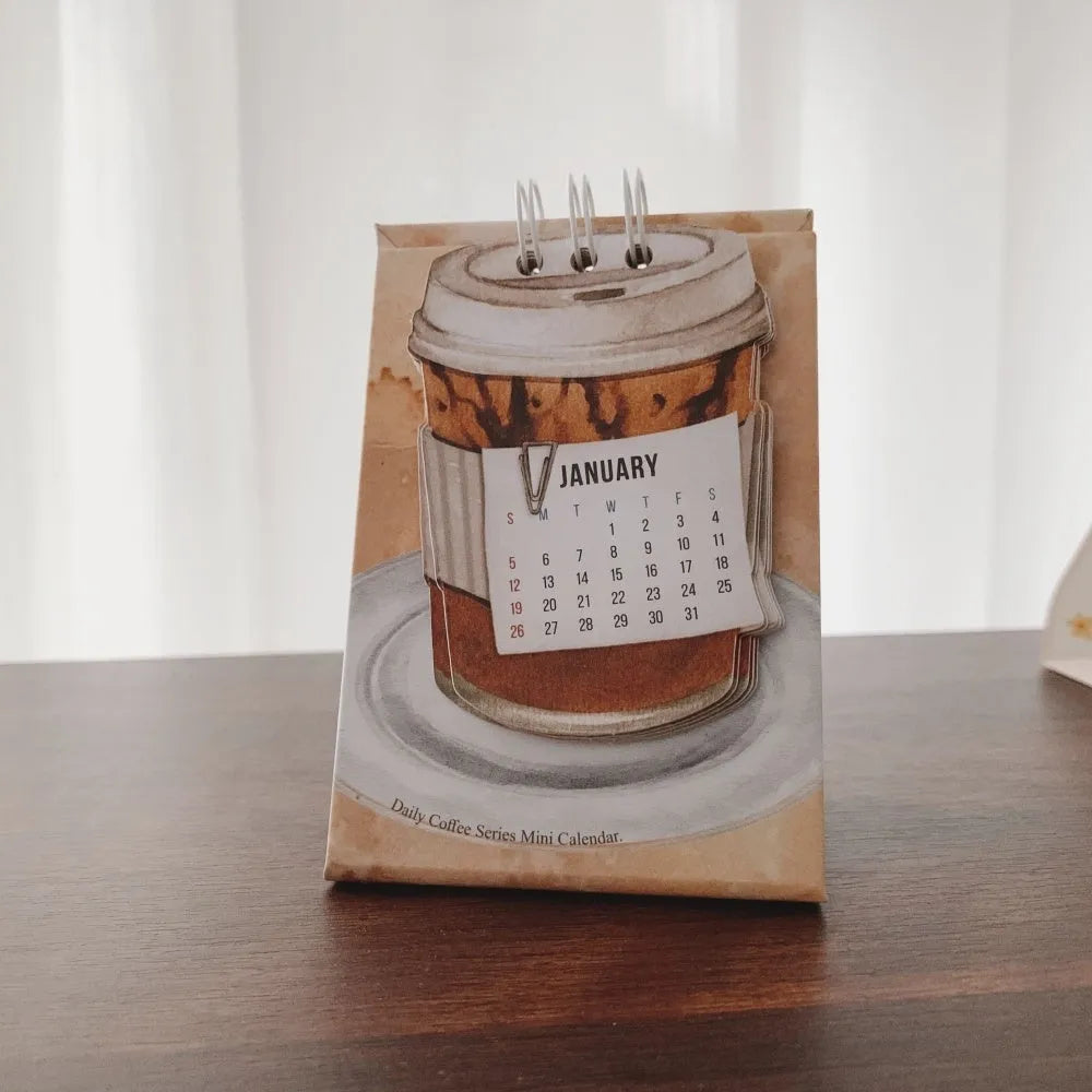 Coffee-themed mini desk calendar for 2025 with motivational designs for compact organisation