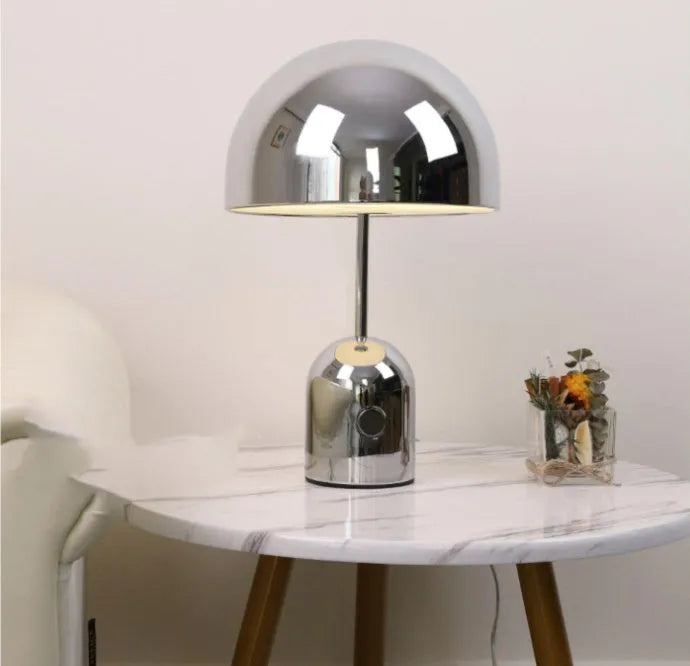 Modern mushroom-shaped table lamp with metal base in rose gold finish