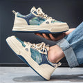 Men's beige and green canvas flat casual shoes with round toe.