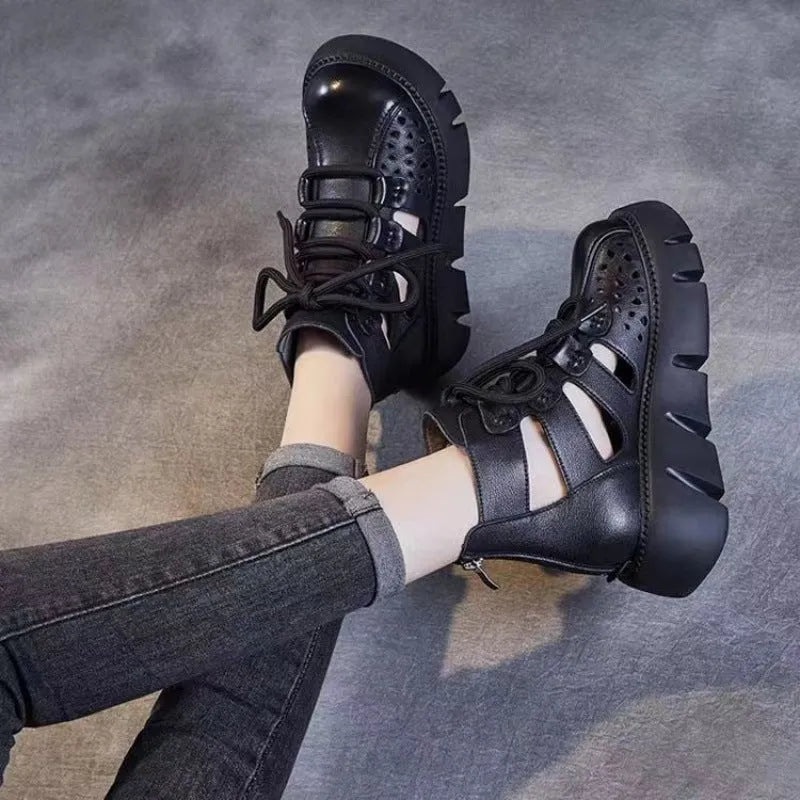 Women's black platform sandals with a hollow hole design and fish mouth toe, made from soft cowhide leather with a PU sole.