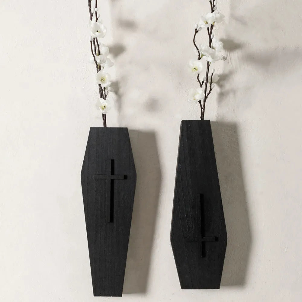 Black wooden cross-shaped wall shelf with dimensions 27cm by 9cm for displaying small decorative items.