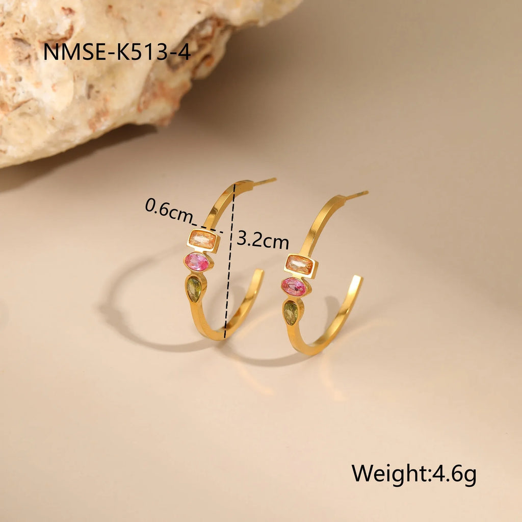 Geometric gold plated jewellery set showing necklace, ring, and earrings with zircon details on stainless steel