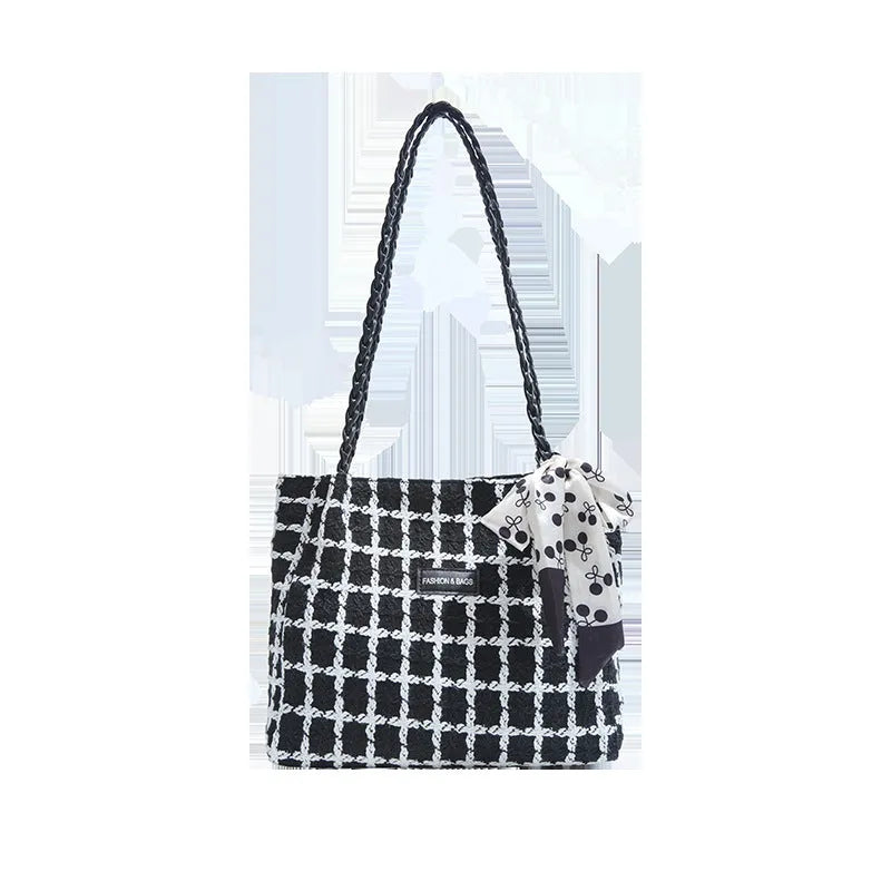 Wool blend shoulder bag in horizontal square shape with organisational compartments and woven sewing details