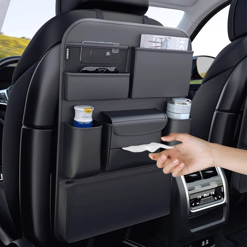 Black leather car seat back storage hanging bag with carrying handle shown attached to vehicle seat