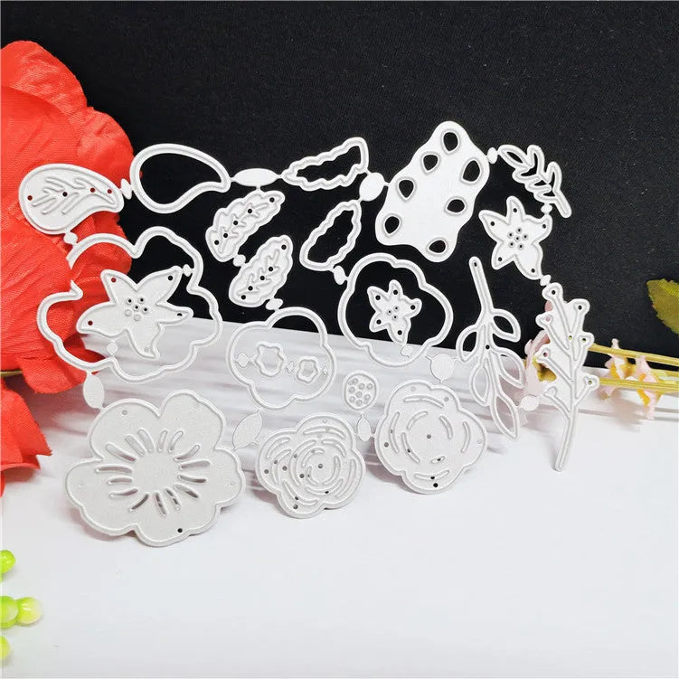 Silver carbon steel flower paper cutting die measuring 14.3 by 9.9 centimetres.