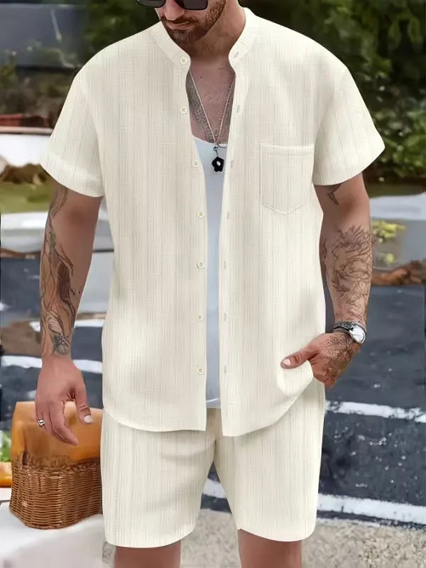 Men's Henry collar short sleeve shirt and shorts set in apricot placed on flat surface