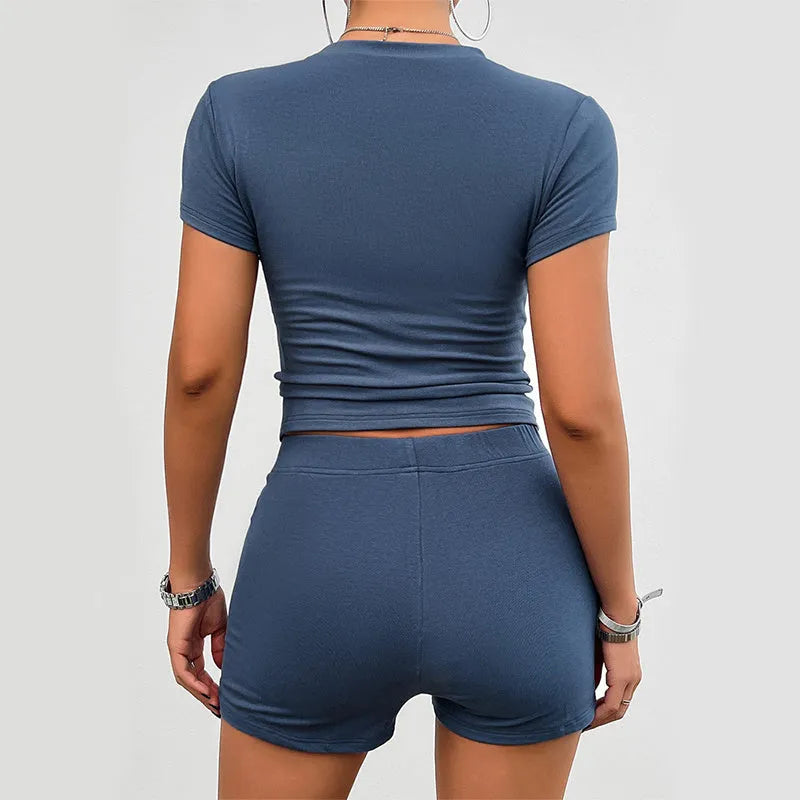 Women's solid colour viscose sports suit comprising a short-sleeve t-shirt and elastic waist shorts.