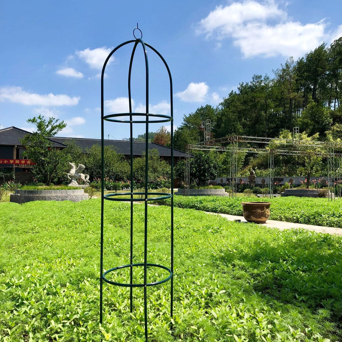 Dark green wrought iron plant climbing frame with lattice design measuring 188x40 cm