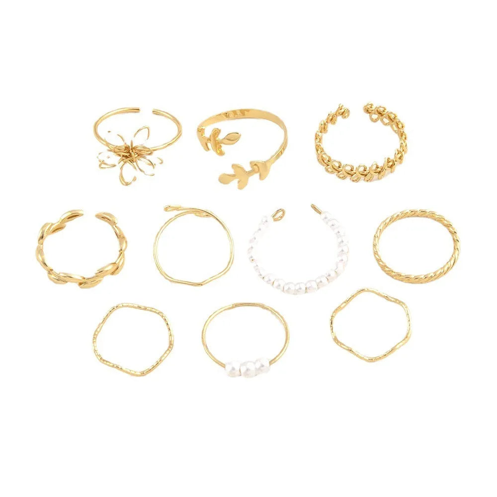 Gold coloured openwork floral design alloy ring set for women, showing glossy electroplated finish.