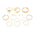 Gold coloured openwork floral design alloy ring set for women, showing glossy electroplated finish.