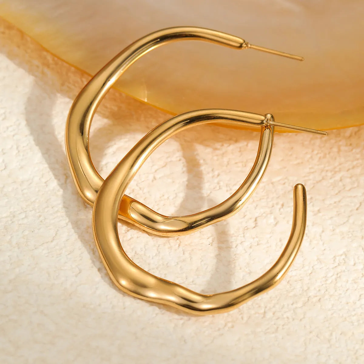 C-ring earrings in stainless steel with 18K gold plating, geometric shape, gold and steel colour options, sold as a pair