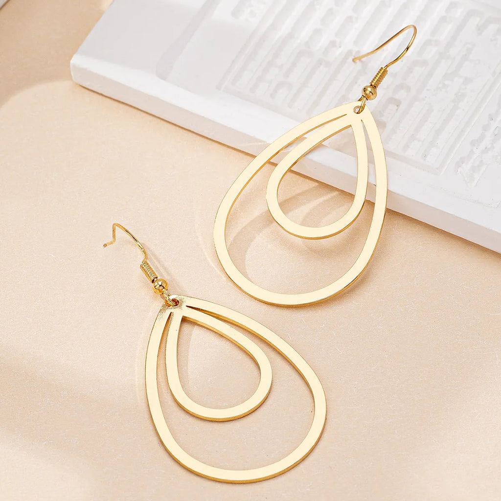 Golden yellow hollow drop earrings made from iron, shown as a pair with an open drop shape