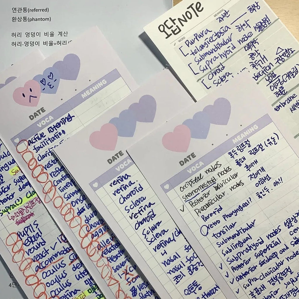 B5 half-size notepad with vertical English words printing in pink, purple, and blue cover colours.