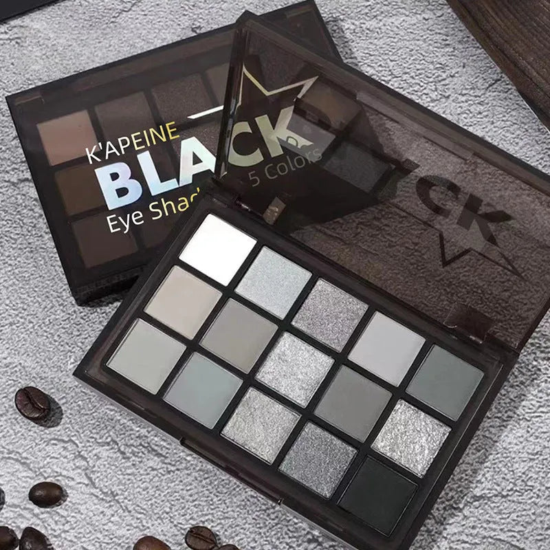 15-colour eyeshadow palette showing earth tones including cos grey, black, and dark colours for smoky makeup