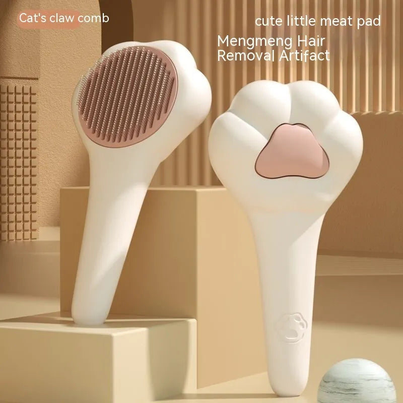 White plastic cat paw pet comb with massage action and one-click hair removal function
