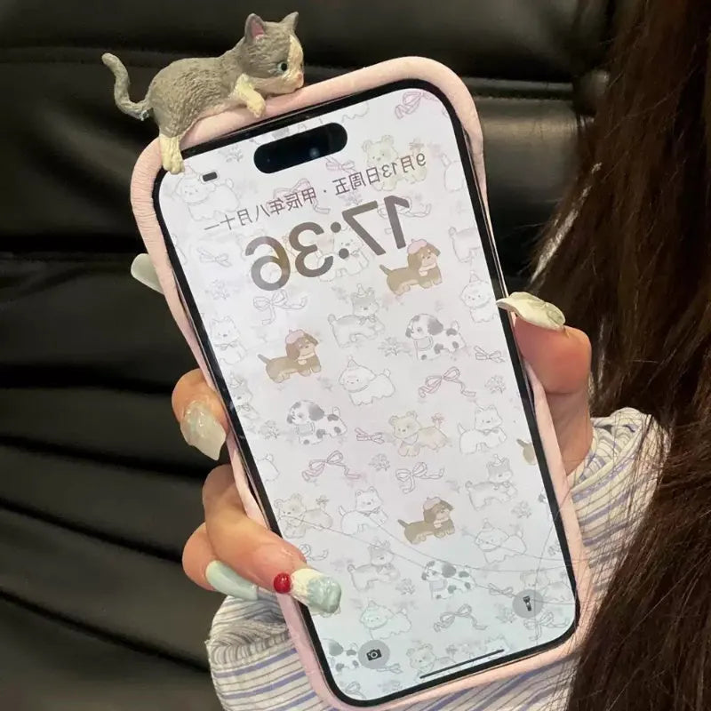 Pink satin texture iPhone case with three-dimensional gray kitten design for drop protection