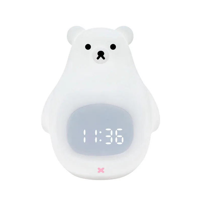 White silicone cartoon bear night light with remote control on a surface.