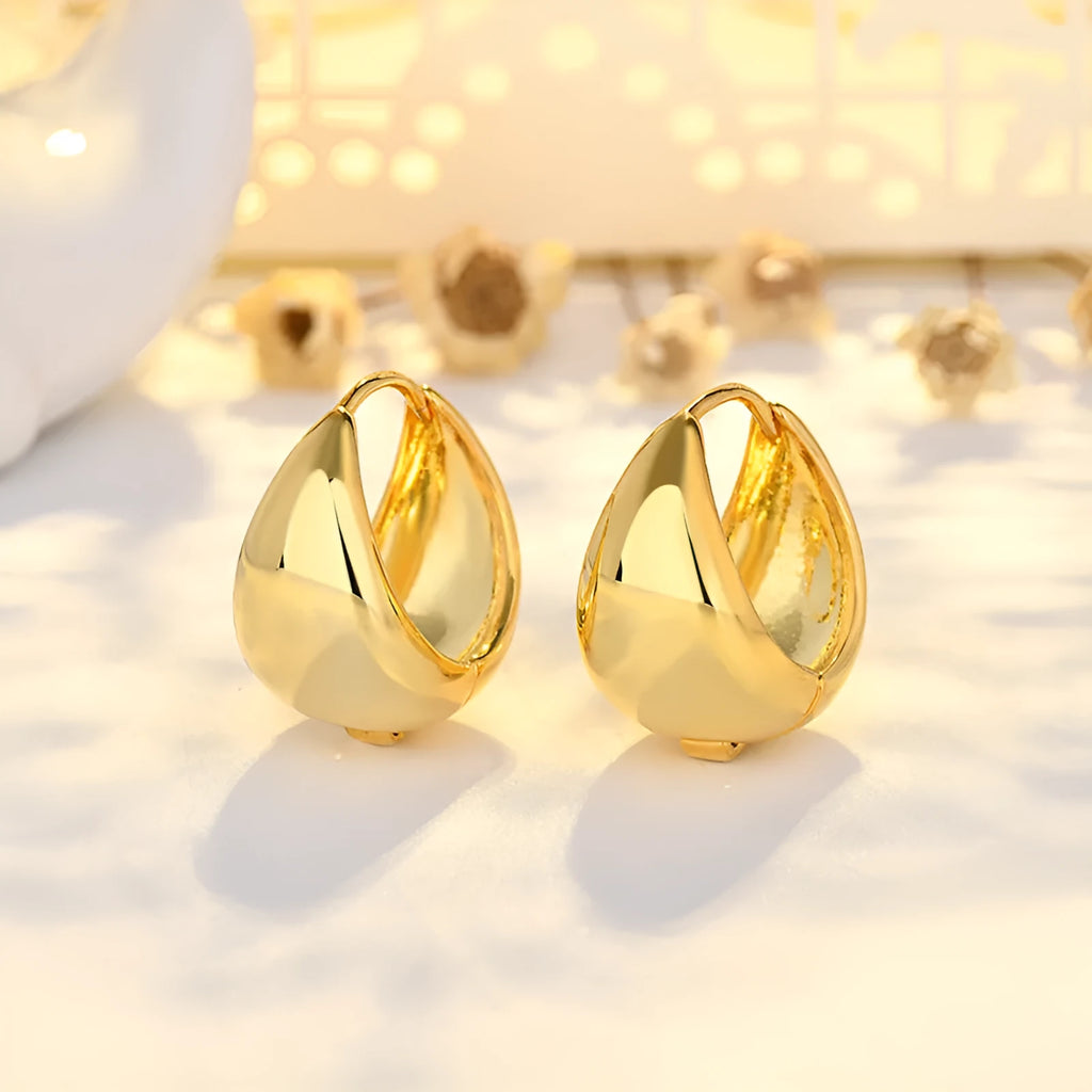 Copper geometric circle ear clips with gold inlay, ellipse and ring shape, shown in gold or white colour options.