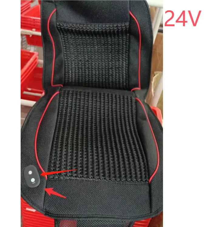 Square black car seat cushion with ventilation and massage functions on a car seat.