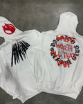 Black hooded sweatshirt with white skull pattern and rhinestone detailing