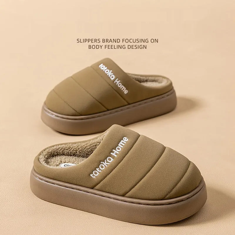 Pair of khaki fleece-lined cotton slippers with round toe and flat platform sole