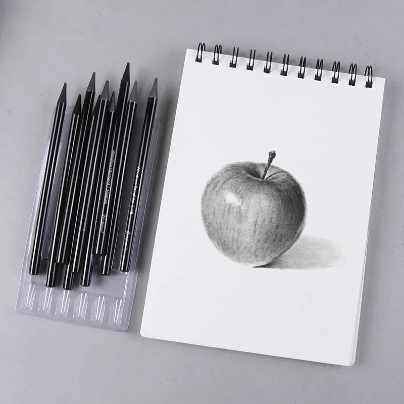 Set of six graphite and three carbonised drawing pencils with wooden shells on suction card packaging.