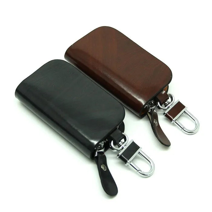 Genuine leather car key case in black or brown with frosted finish and 9.5cm by 4.5cm internal dimensions