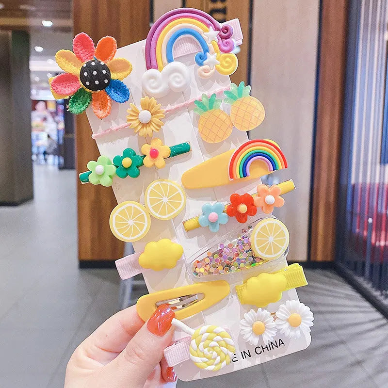14-piece toddler hair accessories set with colourful silicone barrettes and cloth clips depicting candy, fruit, rainbow and butterfly designs.
