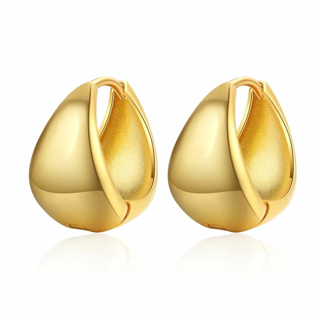 Copper geometric circle ear clips with gold inlay, ellipse and ring shape, shown in gold or white colour options.