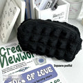 Cream puff style fabric pencil case in beige or black colour made from polyester material
